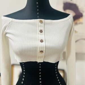 Off shoulder, long sleeve crop top.